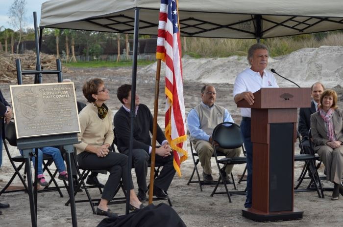 Joe Russo addressing the crowd from a podium 